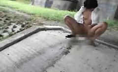 Mature Asian lady is outside virtually naked taking a piss